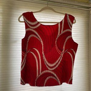 Vivid red pleated blouse with white/black designs